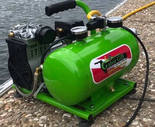 The air compressor is strategically positioned on the seaside to facilitate easy access to compressed air for scuba diving activities